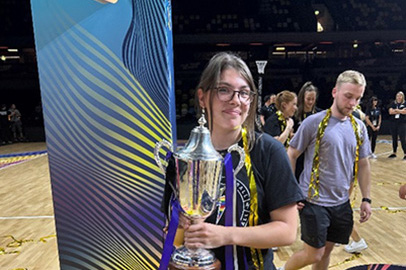 Student holding a trophy